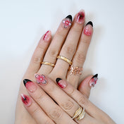 Korean-style cute flower nails with butterfly tips, sheer pink gel, and delicate floral artwork