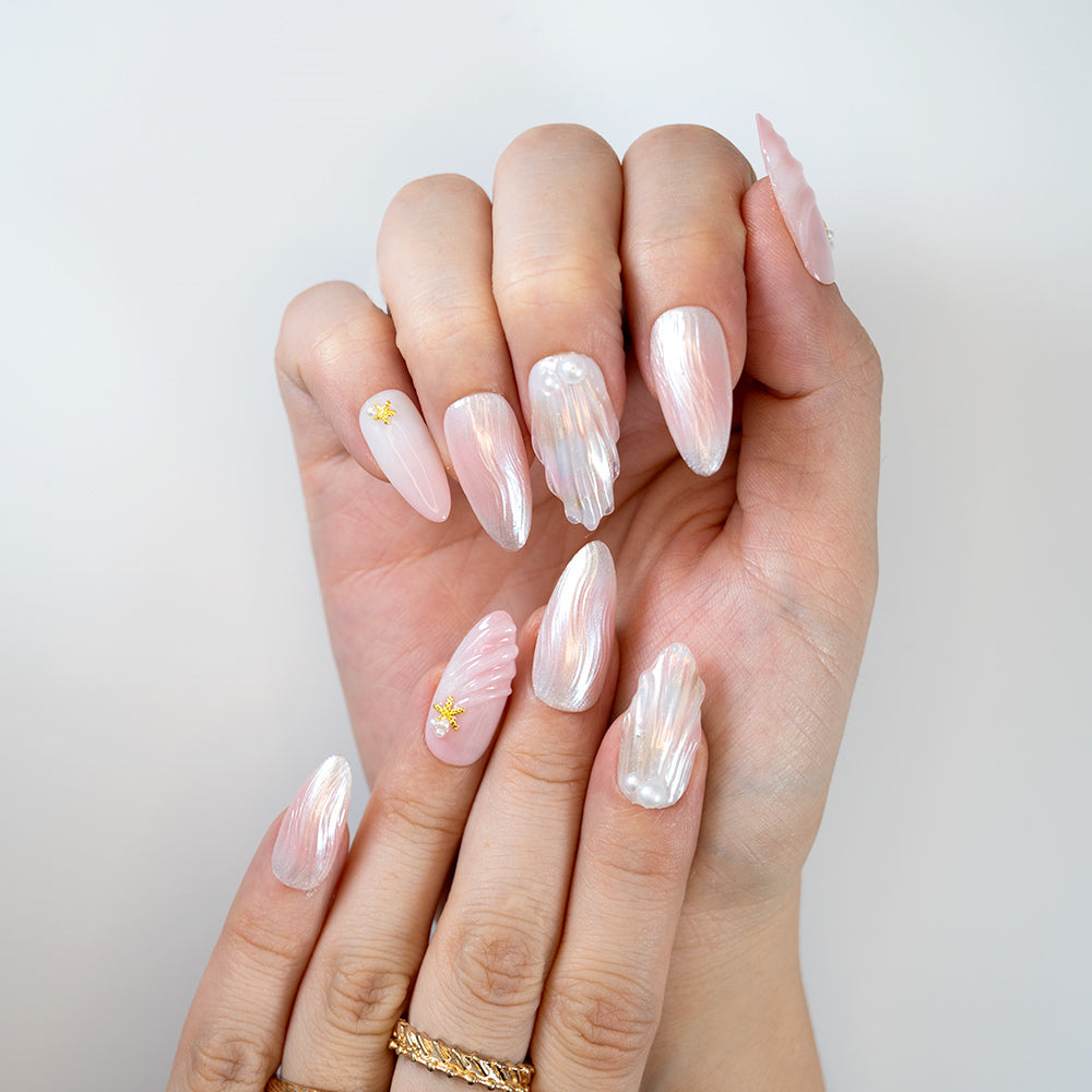  Pearlescent shell-inspired press on nails with 3D sculpted texture and pearl charms