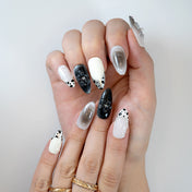  Monochrome press on nails featuring almond shape, shiny mirror tips, and sculpted black flowers