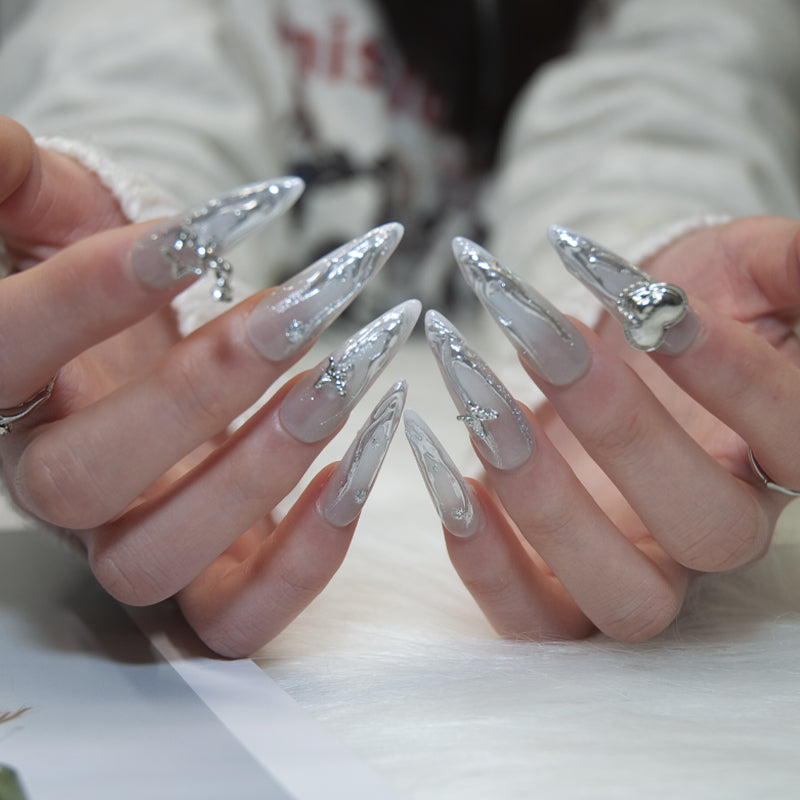 Elegant silver marble nails with heart and star embellishments