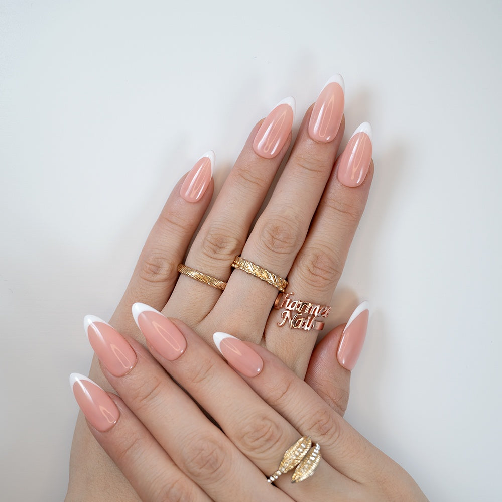 Medium almond-shaped press-on nails featuring timeless French design