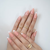 Medium almond-shaped press-on nails featuring timeless French design