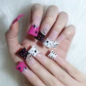 Handmade pink and white nails with star patterns, zebra stripes, and 3D planet stud