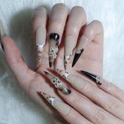 Handmade animal print nails with 3D floral accents and glossy black French tips