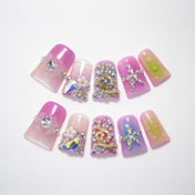 Pink and purple gradient press-on nails with rhinestone and crystal designs