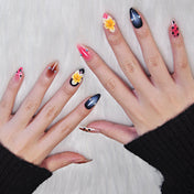 Exotic style press-on nails with animal print tips, 3D flower, and elegant black fade