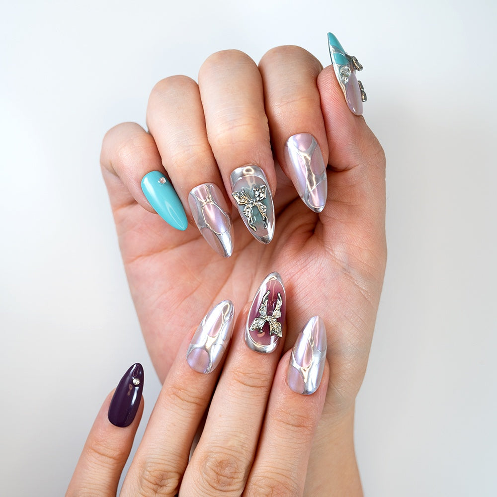 Fairycore butterfly press-on nails in pearl chrome with purple and teal details