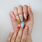 Coral and ocean blue press-on nails with 3D flower and droplet accents