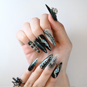 Long stiletto black and green metallic press-on nails with 3D chains and gems