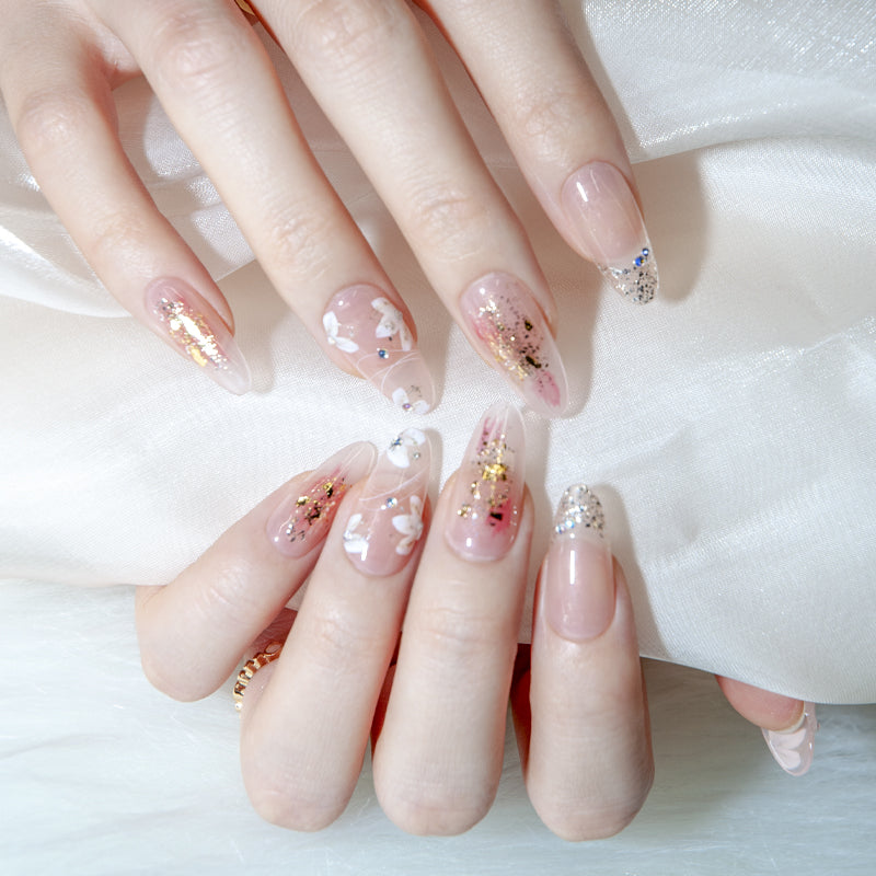 Handmade almond nails with 3D white flowers and glitter tips
