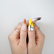 Elegant handmade stiletto nails with gradient ombré, rhinestones, and 3D art