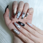 Monochrome gradient press-on nails featuring chrome details and geometric patterns
