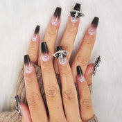 Luxury galaxy-inspired nails with silver orbit design and black heart planet gem