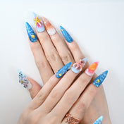 Long stiletto press-on nails with ocean theme, starfish, and seashell accents