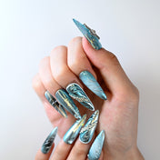 Luxury handmade blue chrome nails with 3D embellishments and glitter