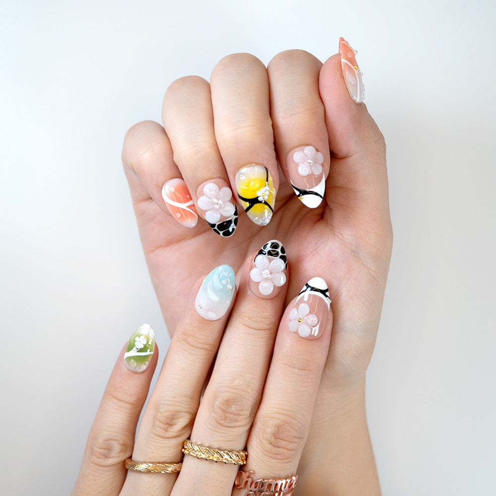 Trendy floral press-on nails in pop art style with vibrant gradients