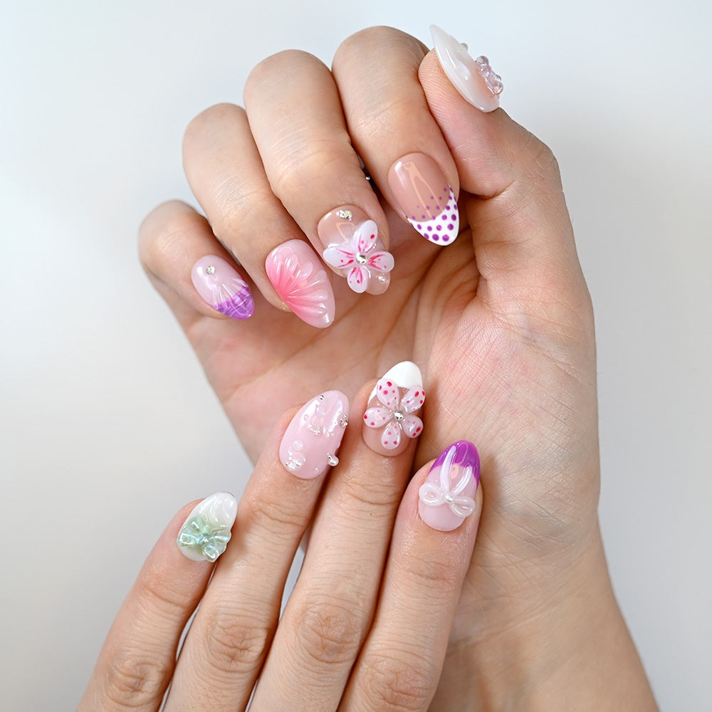 Sweet girl style nails with lilac ombré, pearl details and shimmering 3D bows