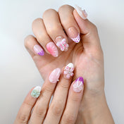 Sweet girl style nails with lilac ombré, pearl details and shimmering 3D bows