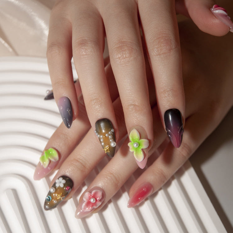 Pink, brown, and purple ombre nails with tropical flower designs