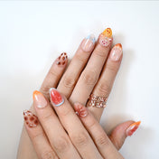 Fresh fruit-inspired press-on nails with kiwi, dragon fruit and butterfly designs