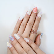 Unique mixed design manicure with mermaid-inspired shine, coral red dots and ocean motifs