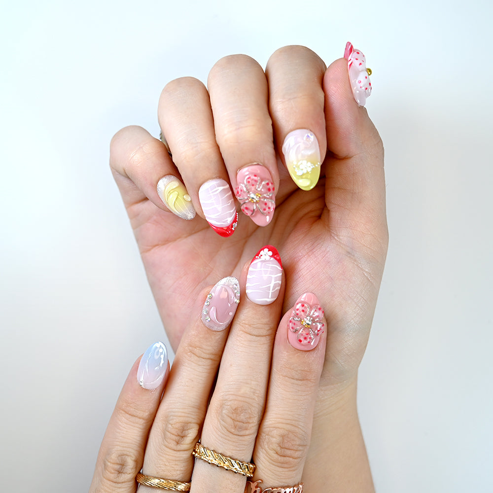Pink and red press-on nails with 3D flowers and rhinestones