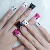 Trendy square nails with hot pink tips, black star art, and bold graphic designs
