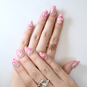 Valentine’s Day press-on nails in pink with 3D crystal heart designs