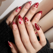 Handmade almond nails with red floral print and polka dots
