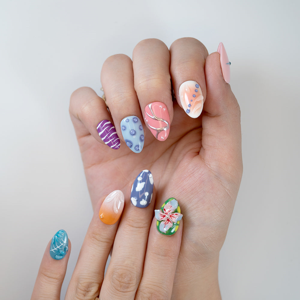Handmade almond nails with purple, orange, and blue vacation vibes