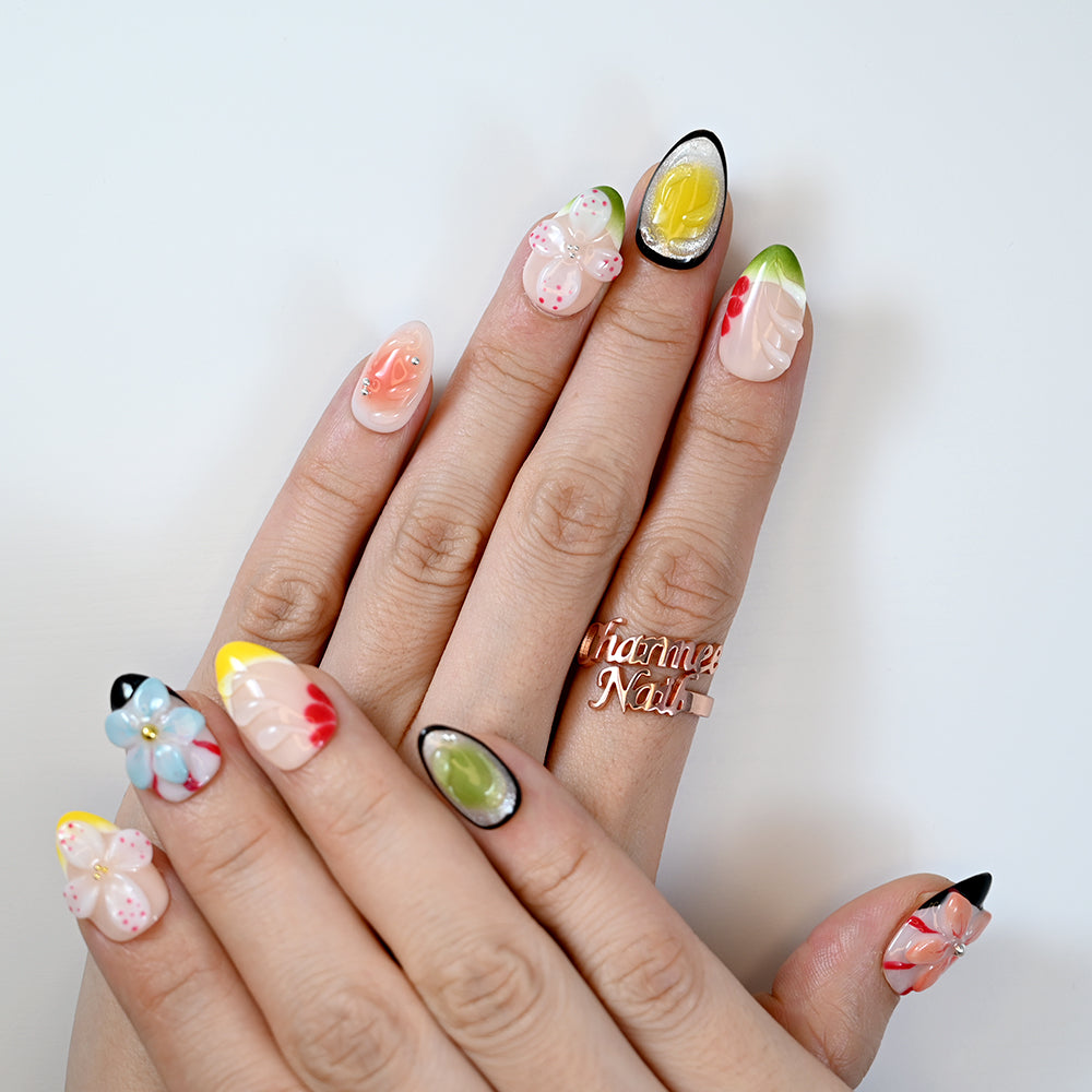 Fruit-inspired press-on nails with 3D flowers and bright summer colors