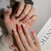 Elegant spring press-on nails with 3D sakura flowers and soft French ombre