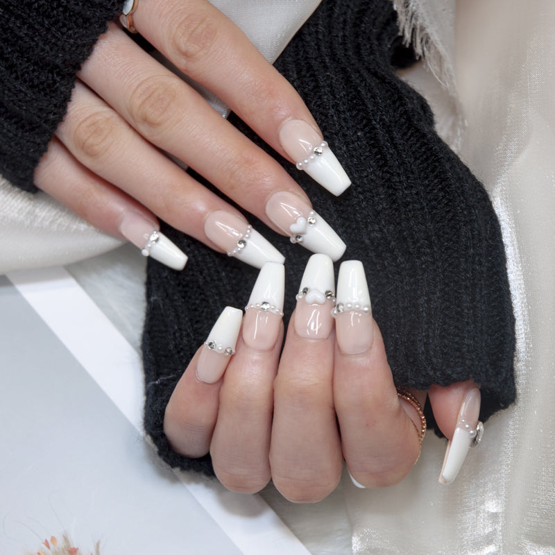 Classy French tip nails in nude white with pearl and silver details