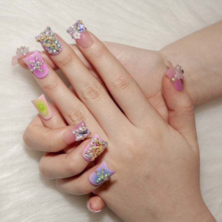 Luxury bling nails with 3D flowers, gold snake charm, and gemstone cross