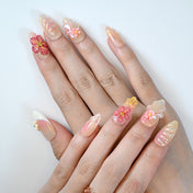 Spring blossom press-on nails in pastel tones with pearl and glitter details