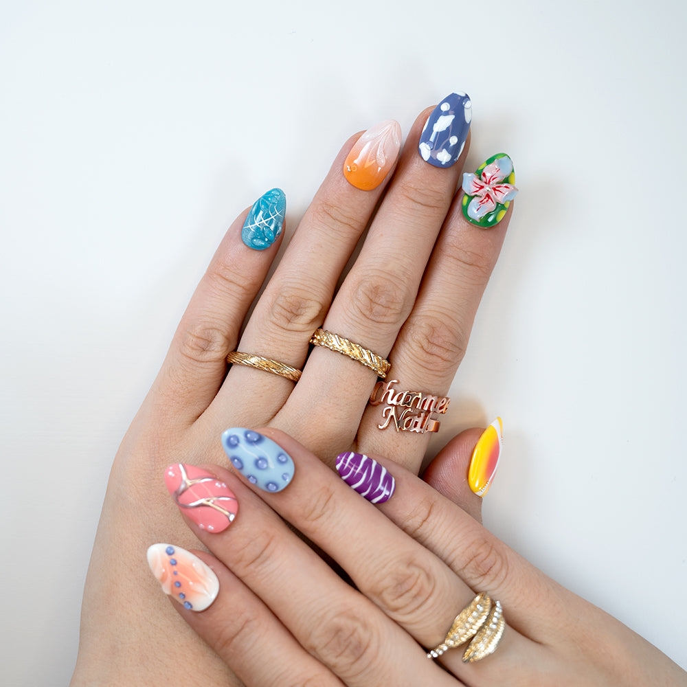Colorful tropical-inspired press-on nails with 3D flower and polka dots