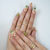 Sweet and wild press ons featuring animal print tips and floral 3D embellishments