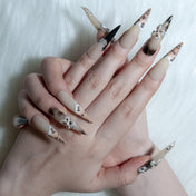 Luxury wild style nails with nude and leopard print design, rhinestones, and 3D flowers
