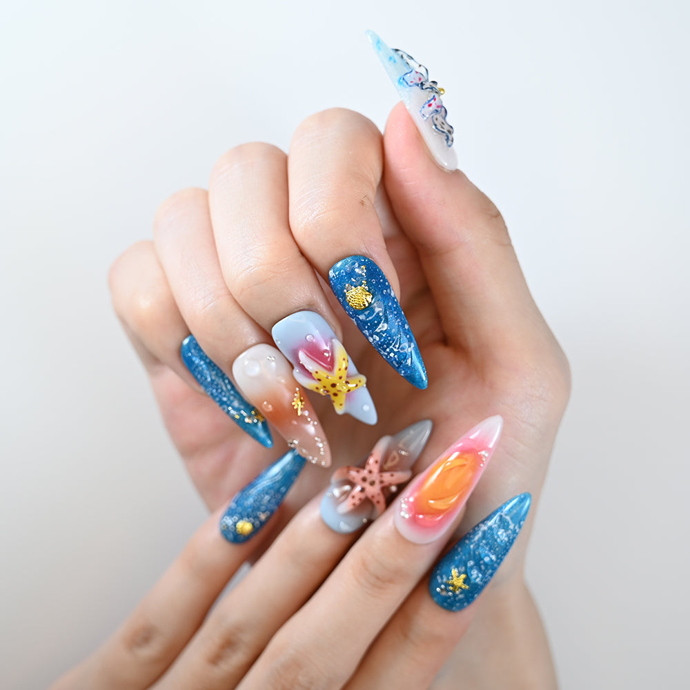 Summer vacation nails with starfish, butterfly, and tropical beach design
