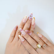 Ombre pink and mauve press-on nails with hand-painted flowers and glossy finish