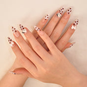 Stylish animal print nails with 3D embellishments and kawaii cat character