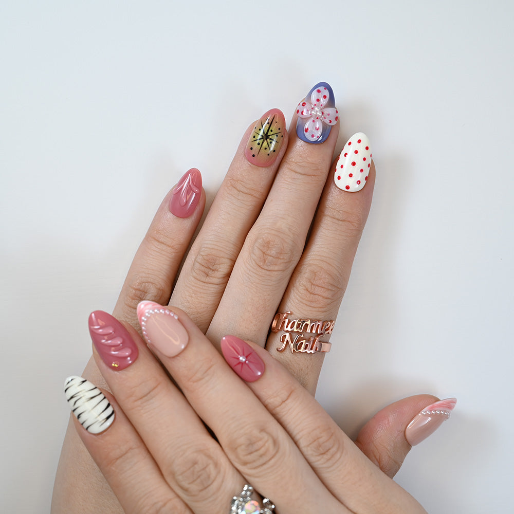 Fashion press-ons in pink, white, and blue with textured petals and chic zebra design