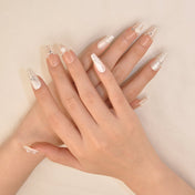 Elegant nude white ombre press-on nails with floral art and shimmering gems
