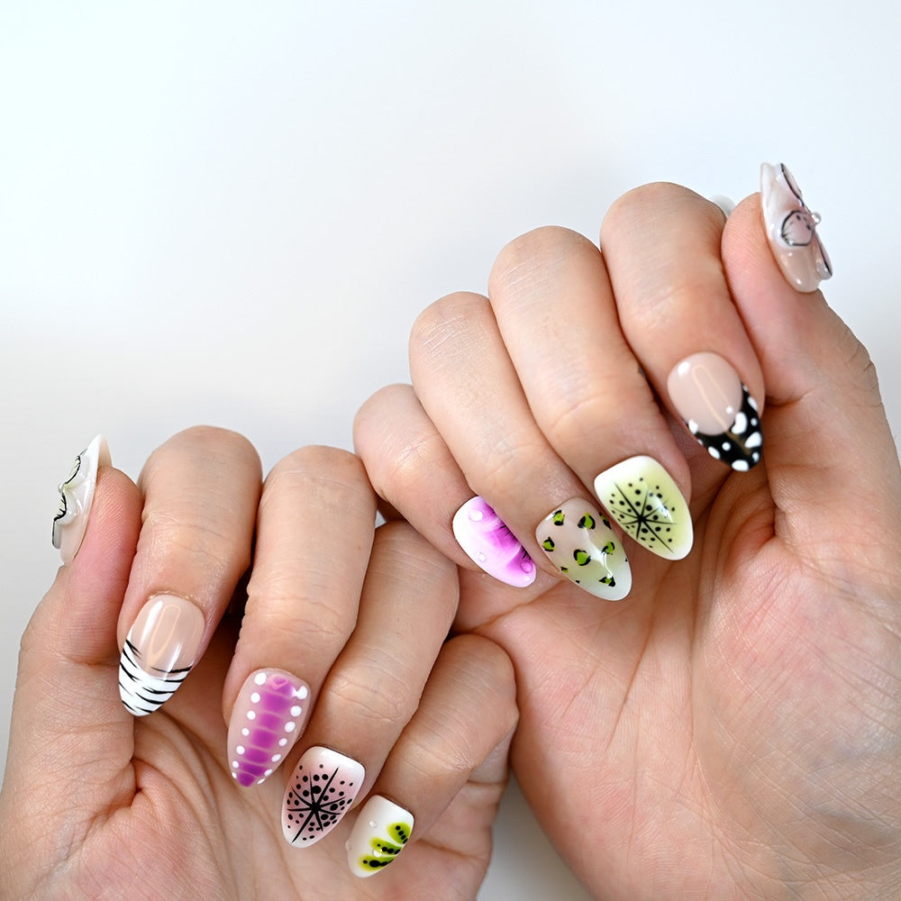 Handmade press-on nails featuring purple gradient, lime green starburst, and leopard dot design