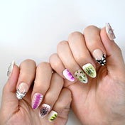 Handmade press-on nails featuring purple gradient, lime green starburst, and leopard dot design