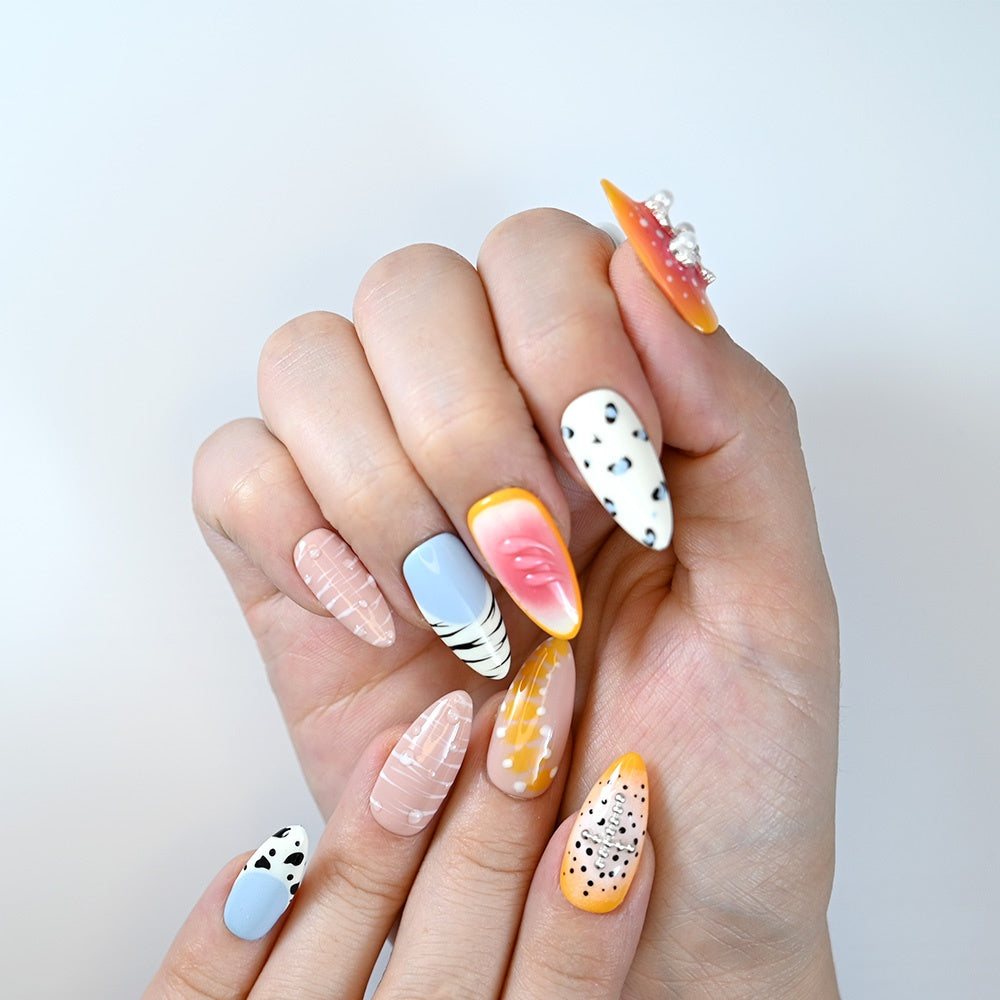 Vibrant press-ons with mixed fruit-inspired designs, white stripes and 3D pearl embellishments