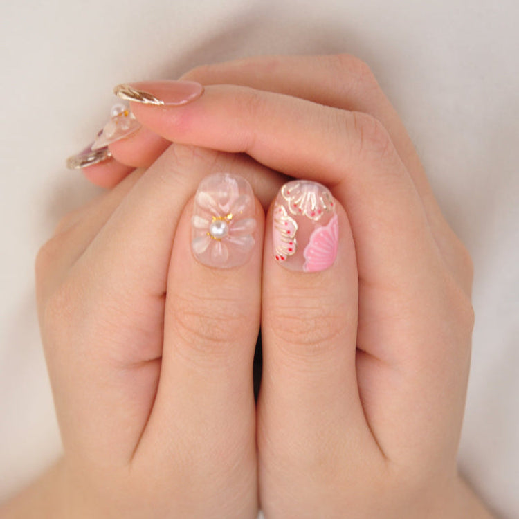 Elegant beach style press-on nails with gold foil, 3D flower, and seashell design