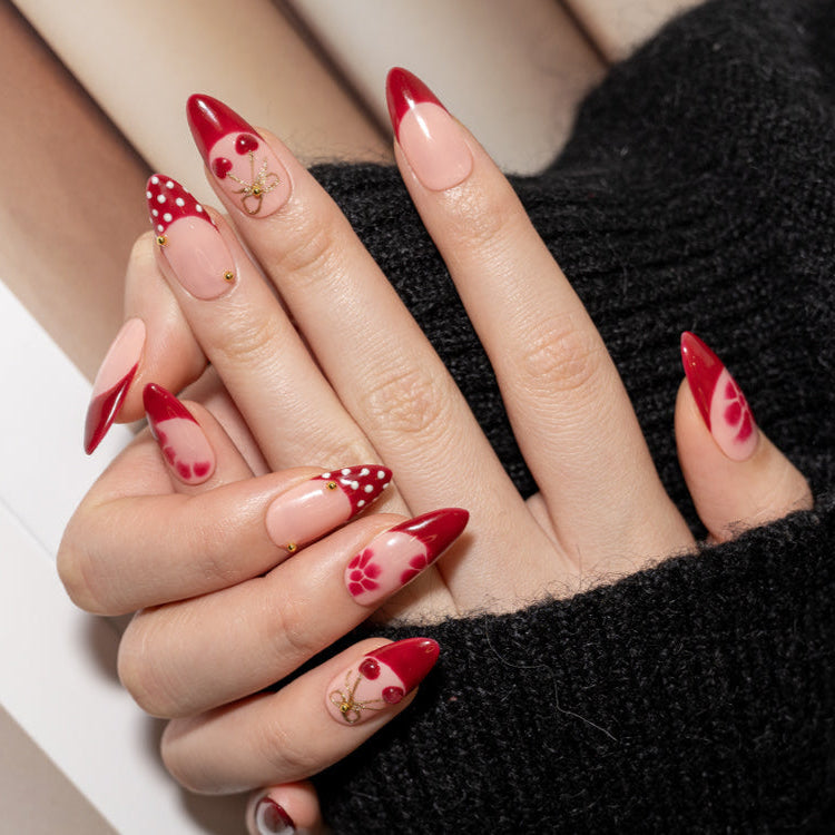 Cute cherry nail design with gold ribbon on glossy press-ons