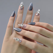Handmade winter nails with shimmering silver chrome and sparkling ice crystal design