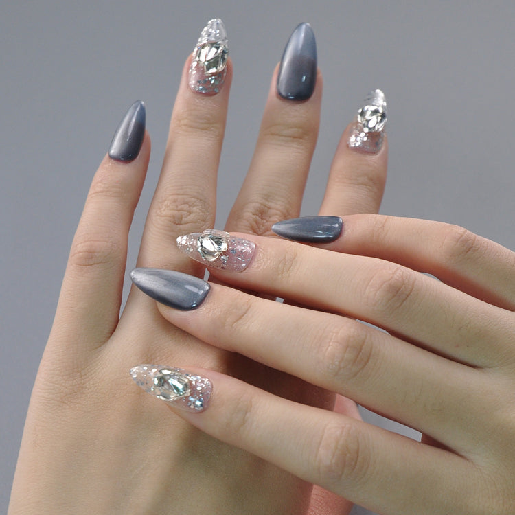 Handmade winter nails with shimmering silver chrome and sparkling ice crystal design